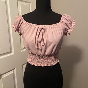 Woman’s pink crop blouse